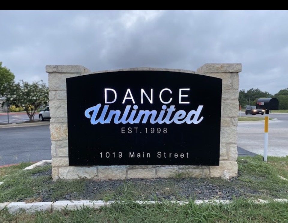 Dance Unlimited sign at 1019 Main Street in Buda